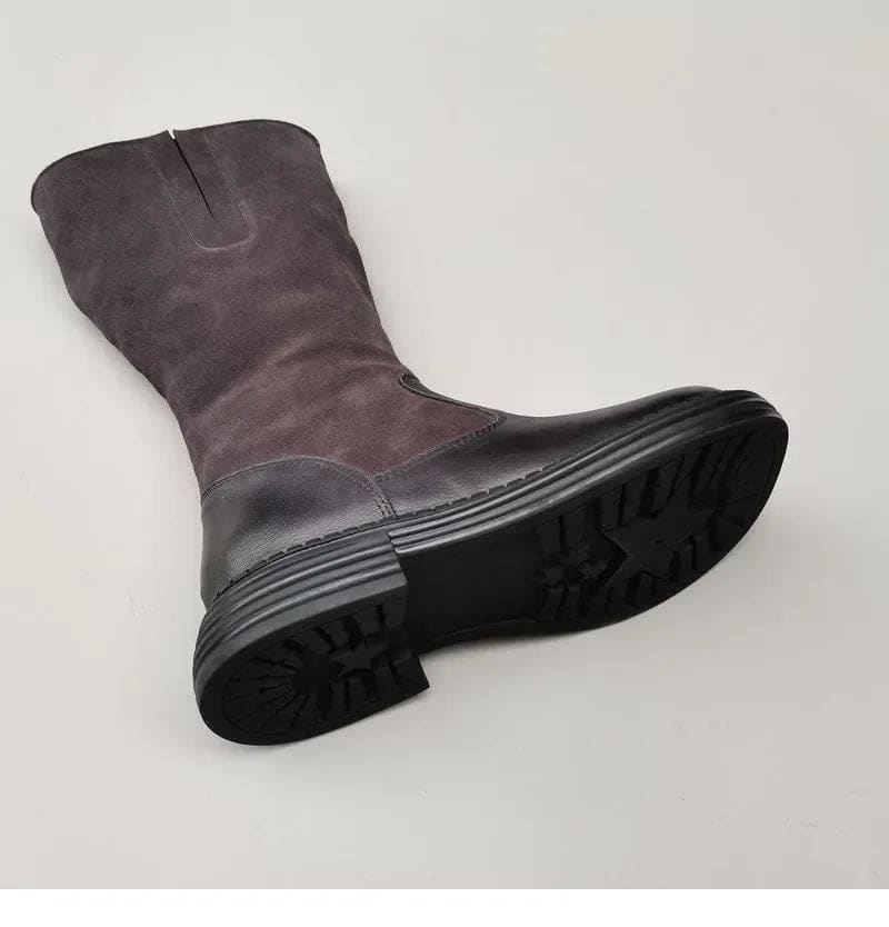 Pair of knee high riding boots with side zipper and plush lining shown from above._22