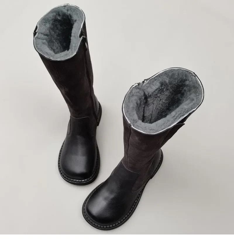 Pair of knee high riding boots with side zipper and plush lining shown from above._3