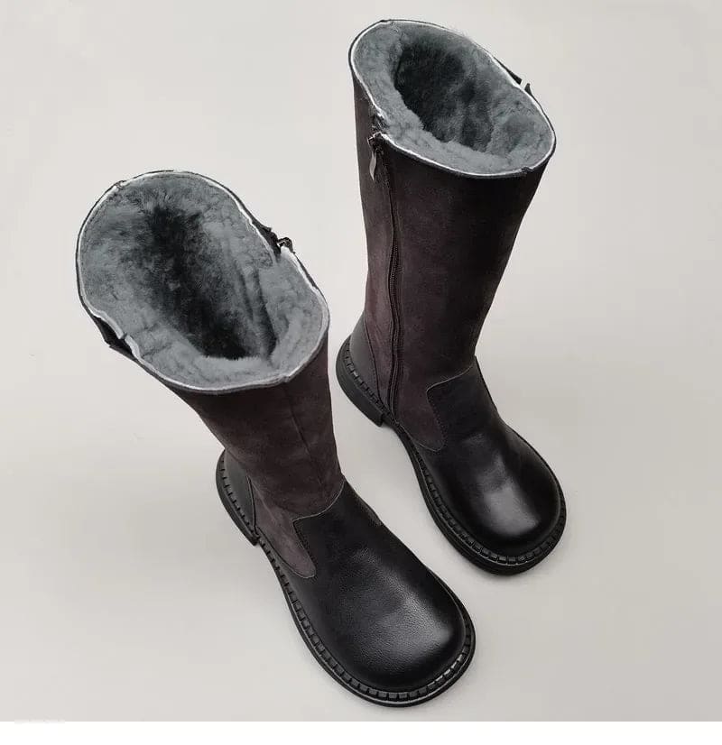 Pair of knee high riding boots with side zipper and plush lining shown from above._4