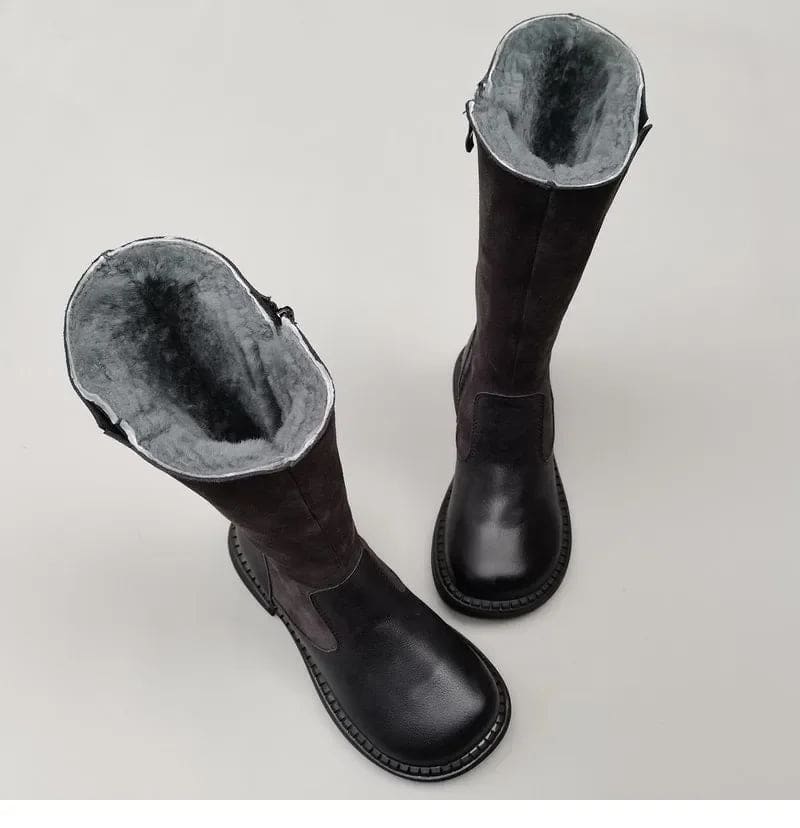 Pair of knee high riding boots with side zipper and plush lining shown from above._5