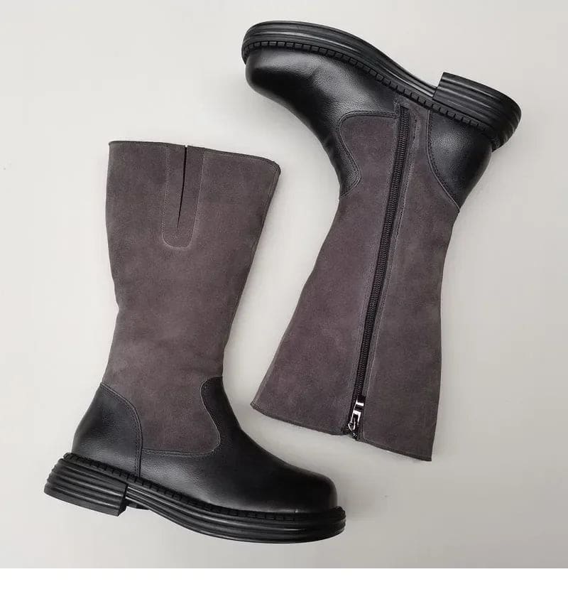 Pair of knee high riding boots with side zipper and plush lining shown from above._6