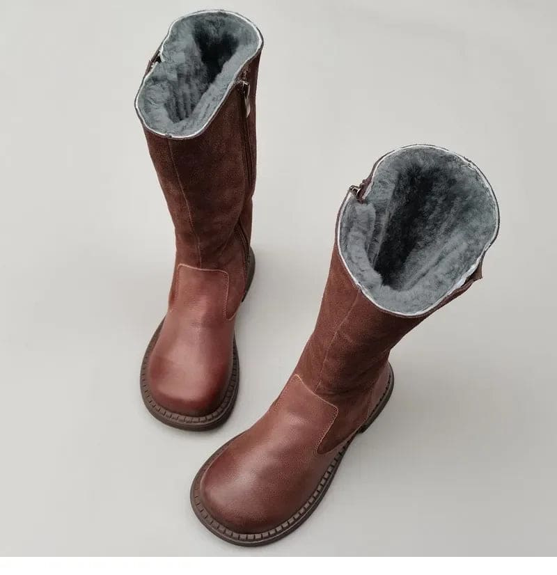 Pair of knee high riding boots with side zipper and plush lining shown from above._7
