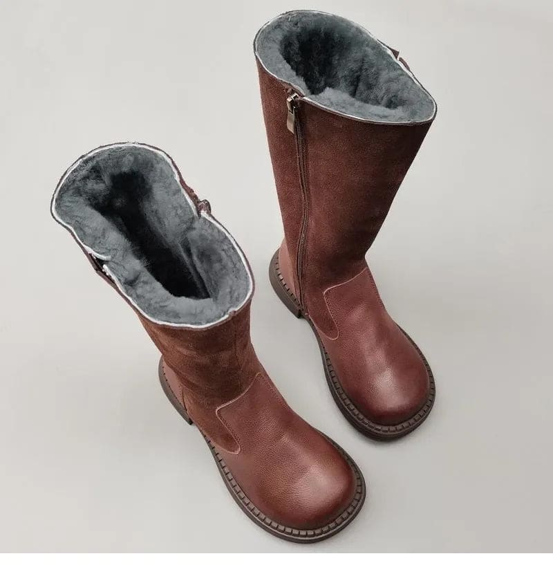 Pair of knee high riding boots with side zipper and plush lining shown from above._8