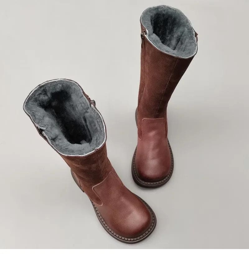 Pair of knee high riding boots with side zipper and plush lining shown from above._9