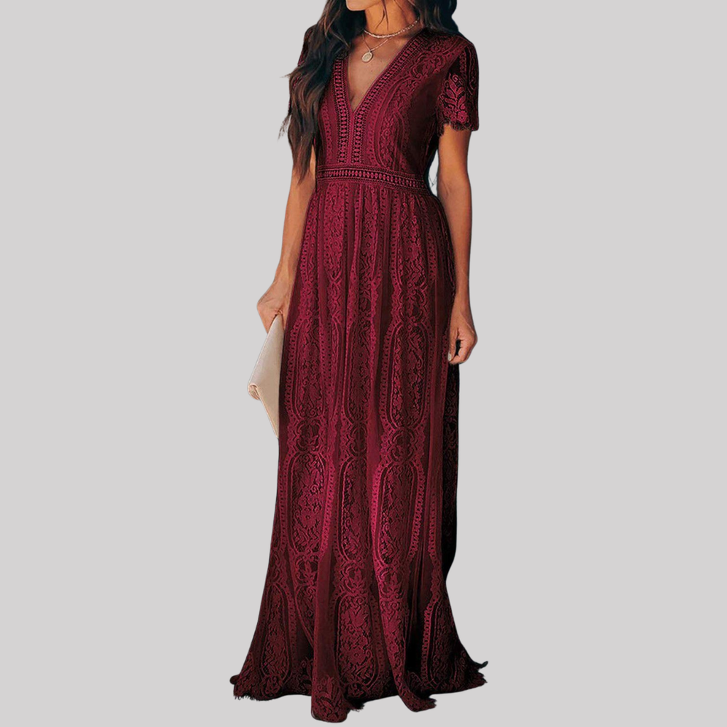 Woman wearing a deep burgundy red maxi dress with intricate lace detailing, v-neckline, short sleeves, and full-length flowing skirt._2