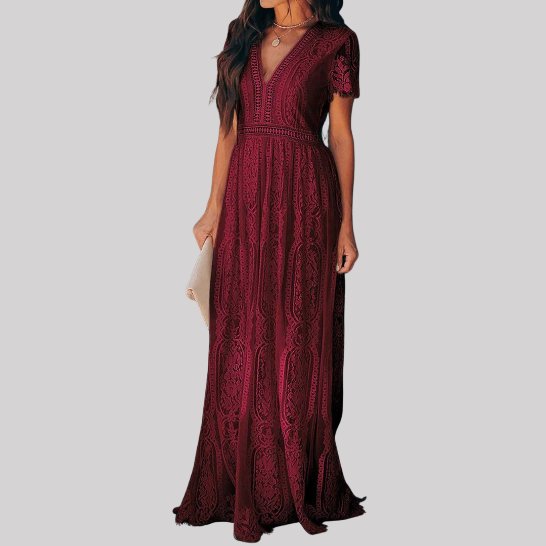 Woman wearing a deep burgundy red maxi dress with intricate lace detailing, v-neckline, short sleeves, and full-length flowing skirt._2