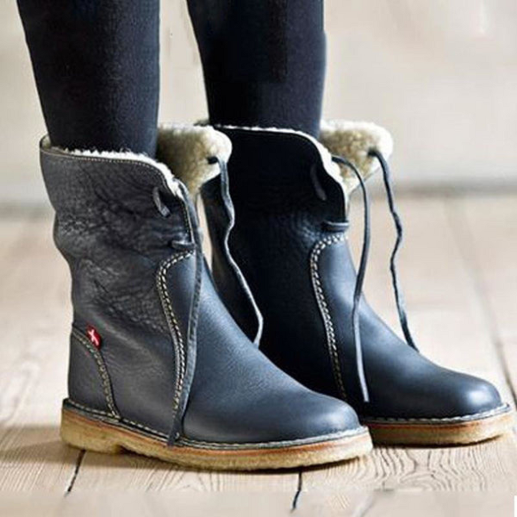 A mid-calf boot in dark grey with a textured upper, lace-up detail at the top, contrast stitching, and a light-colored cushioned sole._5