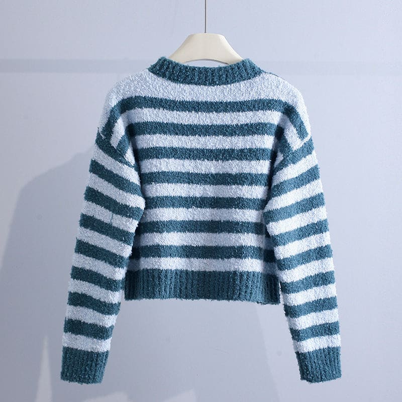 A striped cropped cardigan with a round neckline, button front, long sleeves, and ribbed trim hangs on a hanger._2