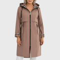 Woman wearing a longline hooded trench coat with zip front, drawstring waist, and patch pockets in a neutral tone._0