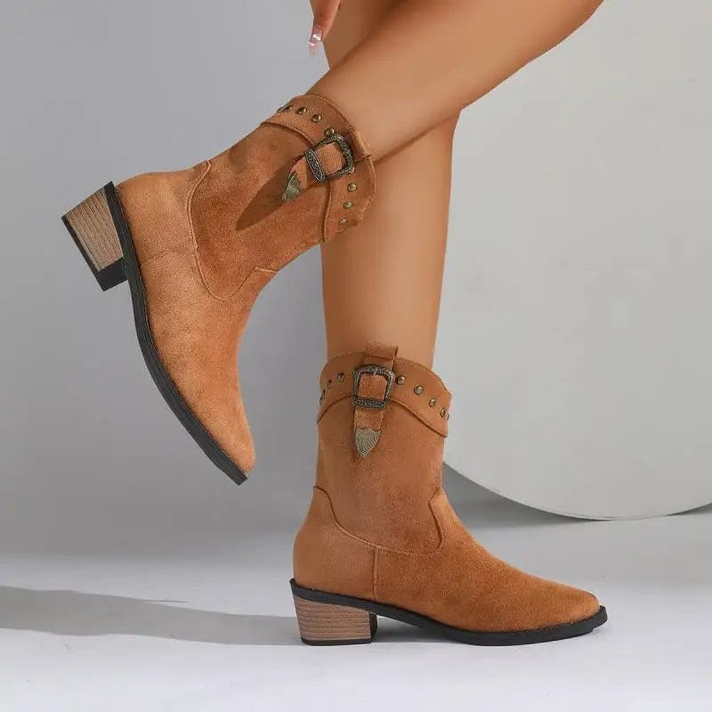 Woman wearing mid-calf boots with buckle strap and stud detailing, paired with bare legs._4
