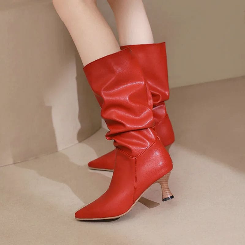 Woman wearing red mid-calf slouch boots with pointed toe and sculpted heel._2