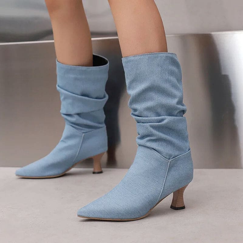 Woman wearing red mid-calf slouch boots with pointed toe and sculpted heel._21