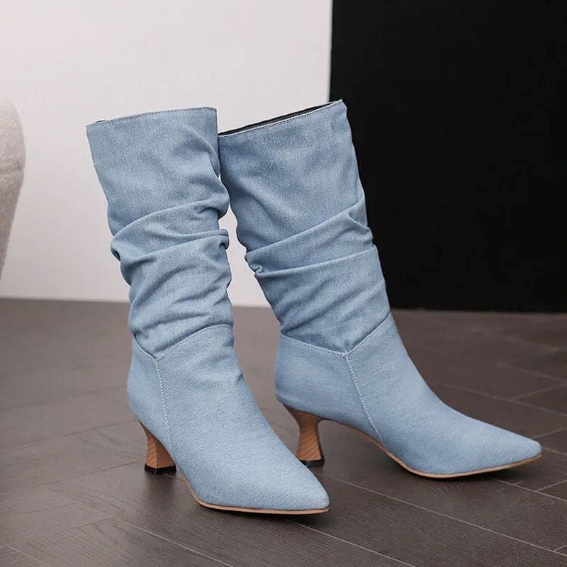 Woman wearing red mid-calf slouch boots with pointed toe and sculpted heel._23