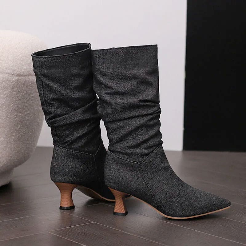 Woman wearing red mid-calf slouch boots with pointed toe and sculpted heel._27