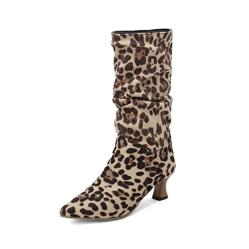 Woman wearing red mid-calf slouch boots with pointed toe and sculpted heel._30
