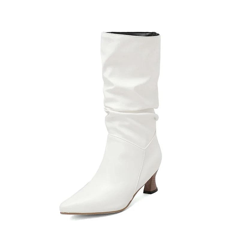 Woman wearing red mid-calf slouch boots with pointed toe and sculpted heel._33