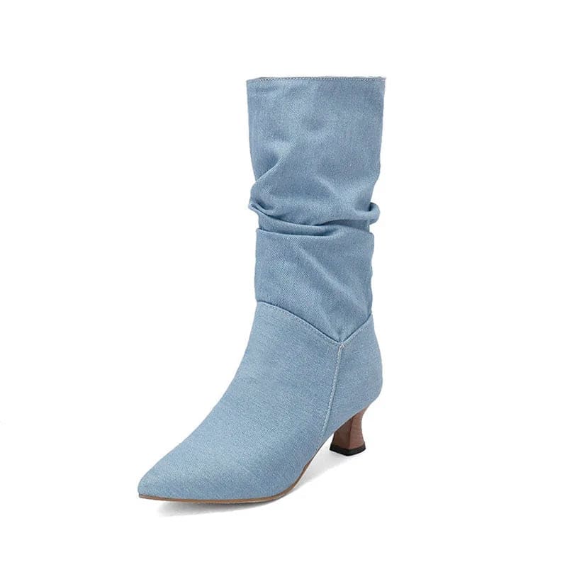 Woman wearing red mid-calf slouch boots with pointed toe and sculpted heel._34
