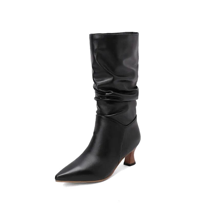 Woman wearing red mid-calf slouch boots with pointed toe and sculpted heel._35