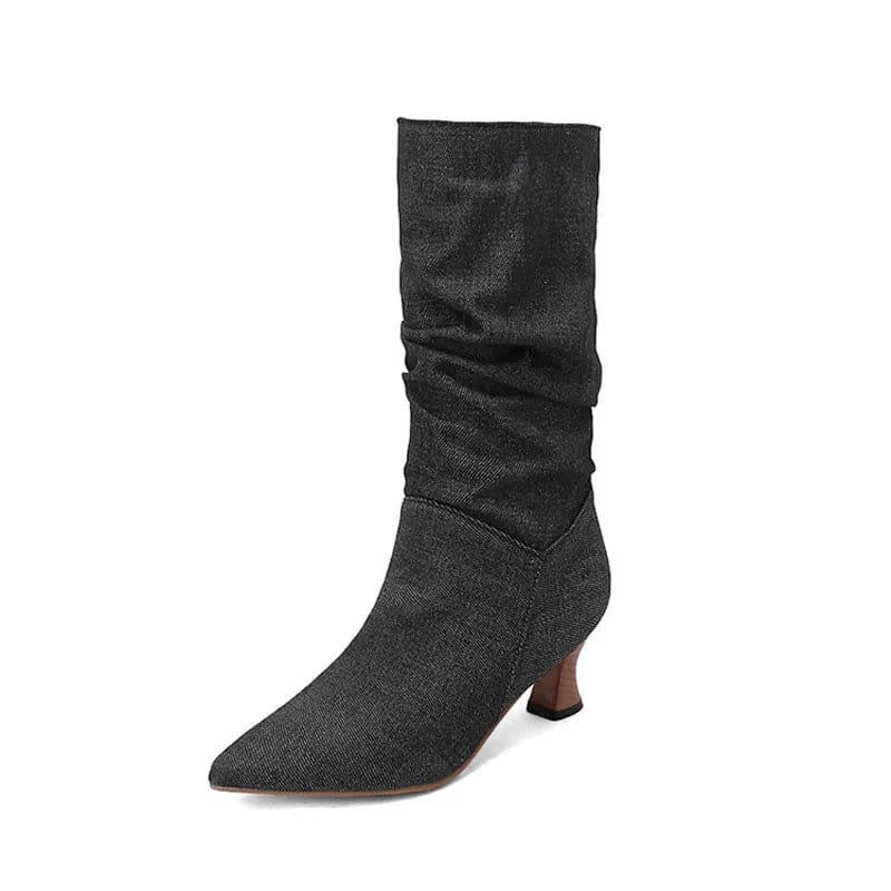 Woman wearing red mid-calf slouch boots with pointed toe and sculpted heel._36