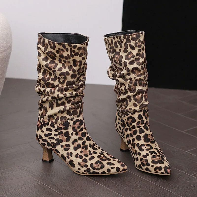 Woman wearing red mid-calf slouch boots with pointed toe and sculpted heel._5