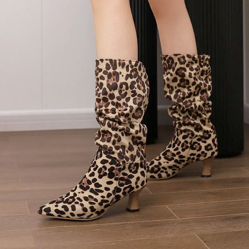 Woman wearing red mid-calf slouch boots with pointed toe and sculpted heel._8