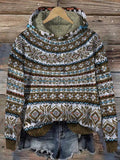 Nordic-pattern hooded sweater in olive green, cream, and brown with geometric bands across the front and ribbed sleeve cuffs.