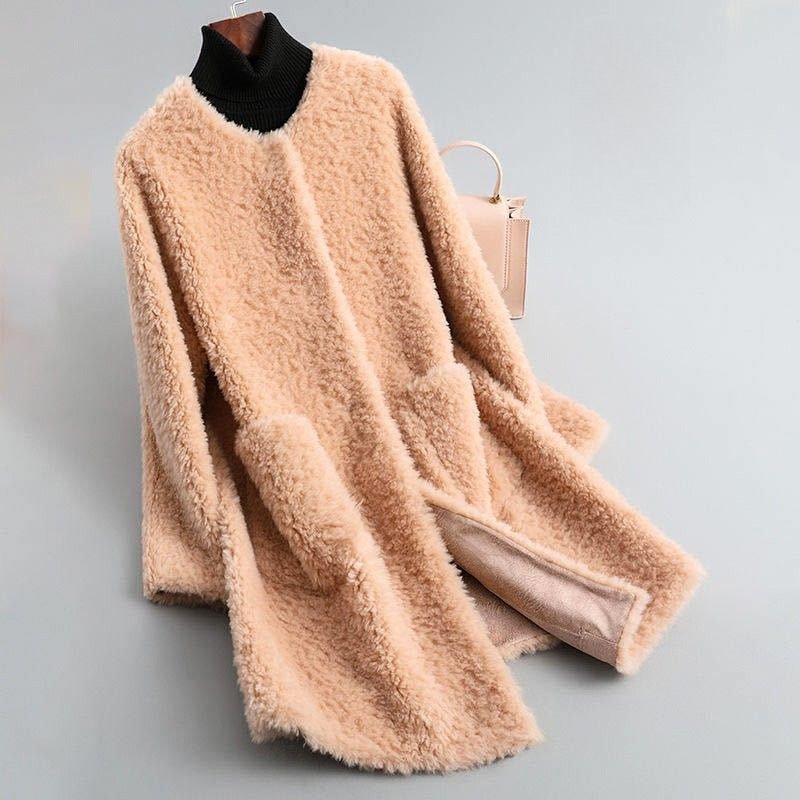 Peach plush longline coat shown open at the front, with softly draped panels and a pale lining visible near the hem.