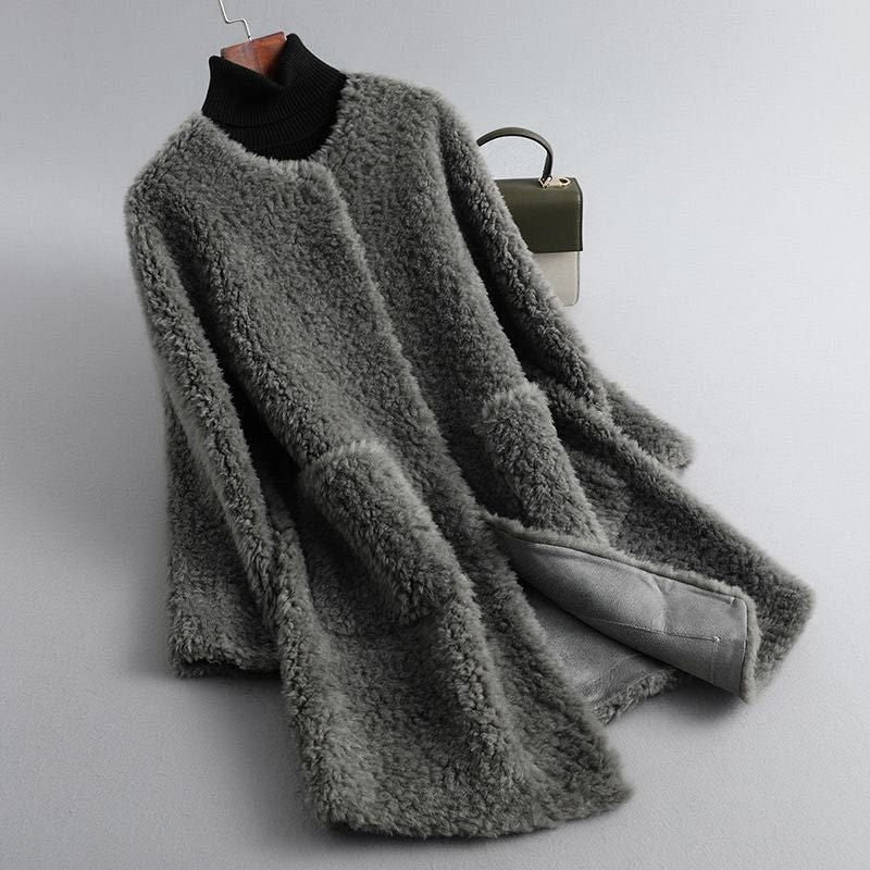 Charcoal gray plush longline coat hanging open, showing the textured pile, elongated silhouette, and gray inner lining.