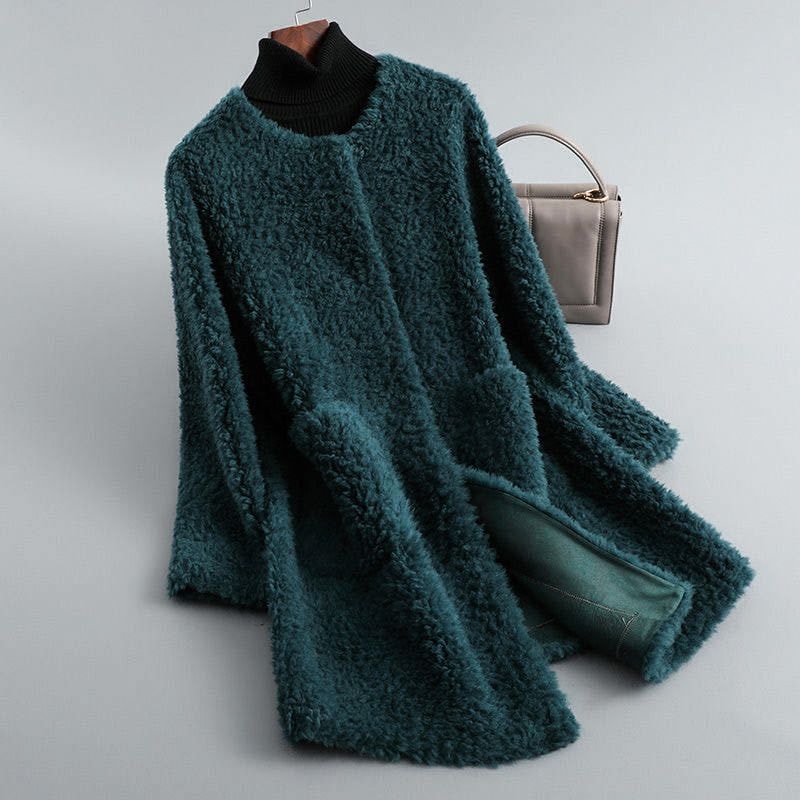 Deep teal plush open-front coat presented in a long silhouette, with its front edges spread to reveal teal lining.