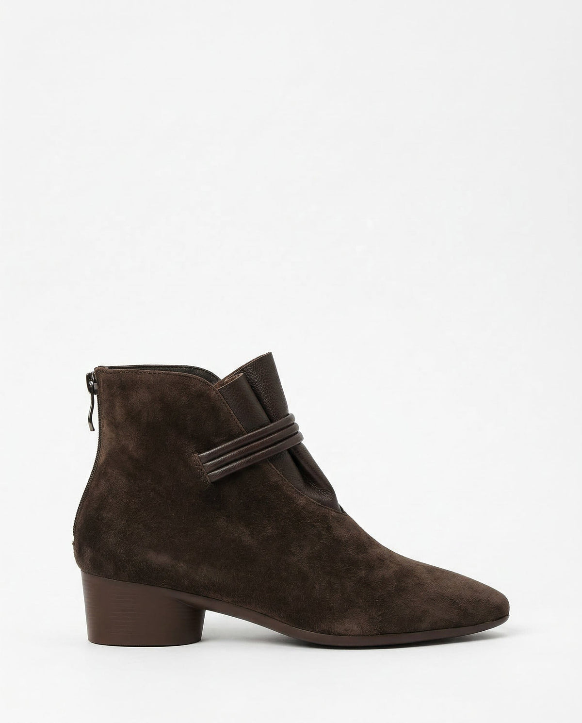 A side view of a pointed toe ankle boot with a decorative strap detail and low block heel._0