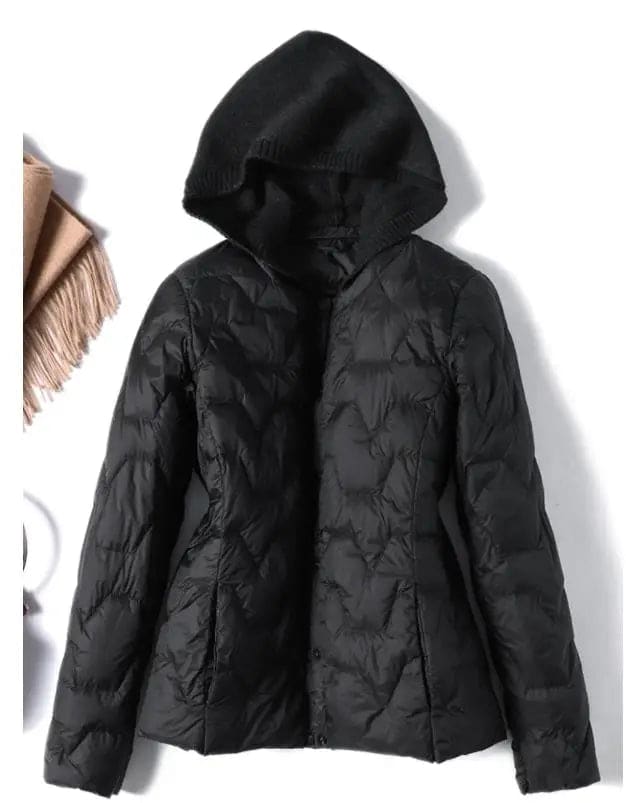 Woman wearing a quilted hooded jacket in a neutral tone with knit hood detail._5