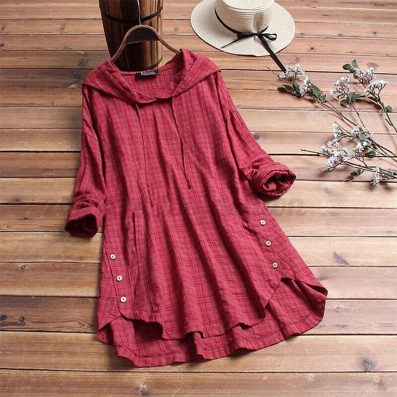 Red relaxed-fit tunic hoodie with a longline shape, soft hood, long sleeves, side button details, and a flowing uneven hem.