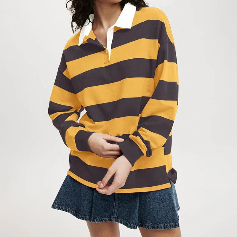 Model wearing a relaxed long sleeve rugby shirt with wide horizontal stripes, a contrast collar, and a partial button placket._0