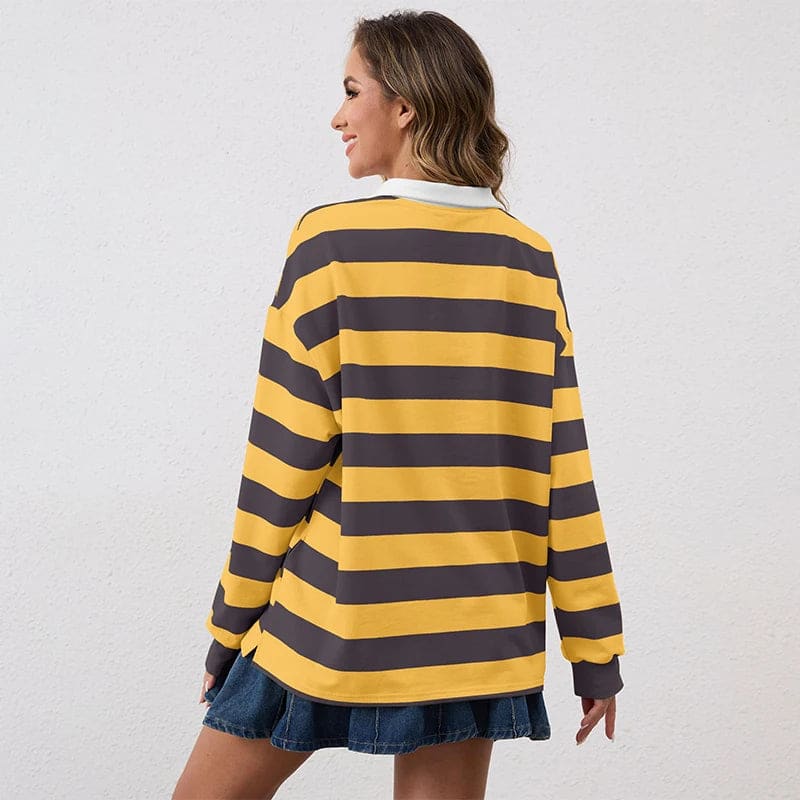 Model wearing a relaxed long sleeve rugby shirt with wide horizontal stripes, a contrast collar, and a partial button placket._1