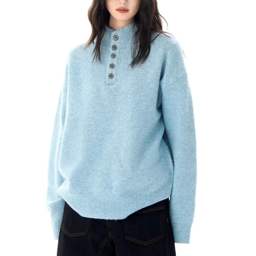 A model wears a relaxed fit mock neck Henley sweater with a buttoned neckline and ribbed hem._1