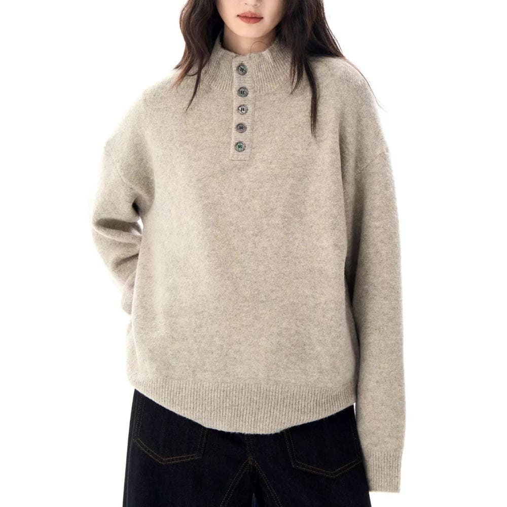 A model wears a relaxed fit mock neck Henley sweater with a buttoned neckline and ribbed hem._4
