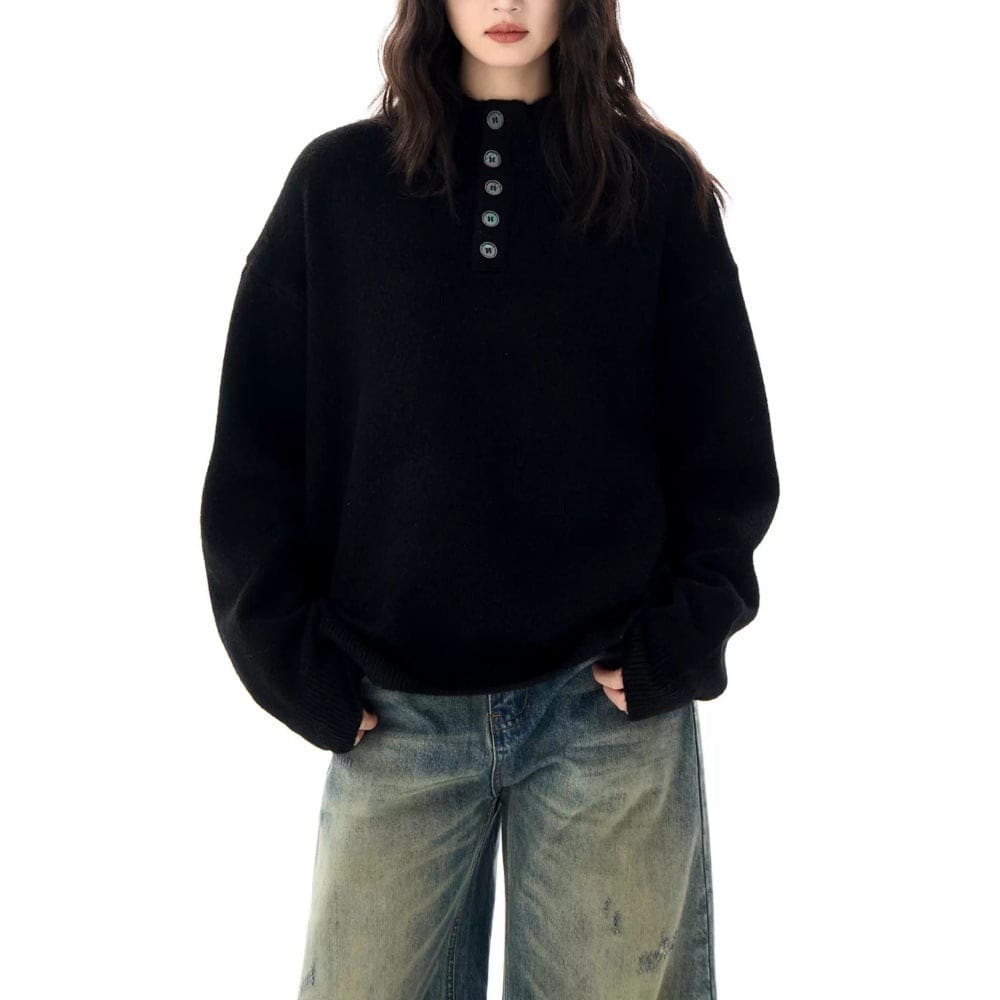 A model wears a relaxed fit mock neck Henley sweater with a buttoned neckline and ribbed hem._7