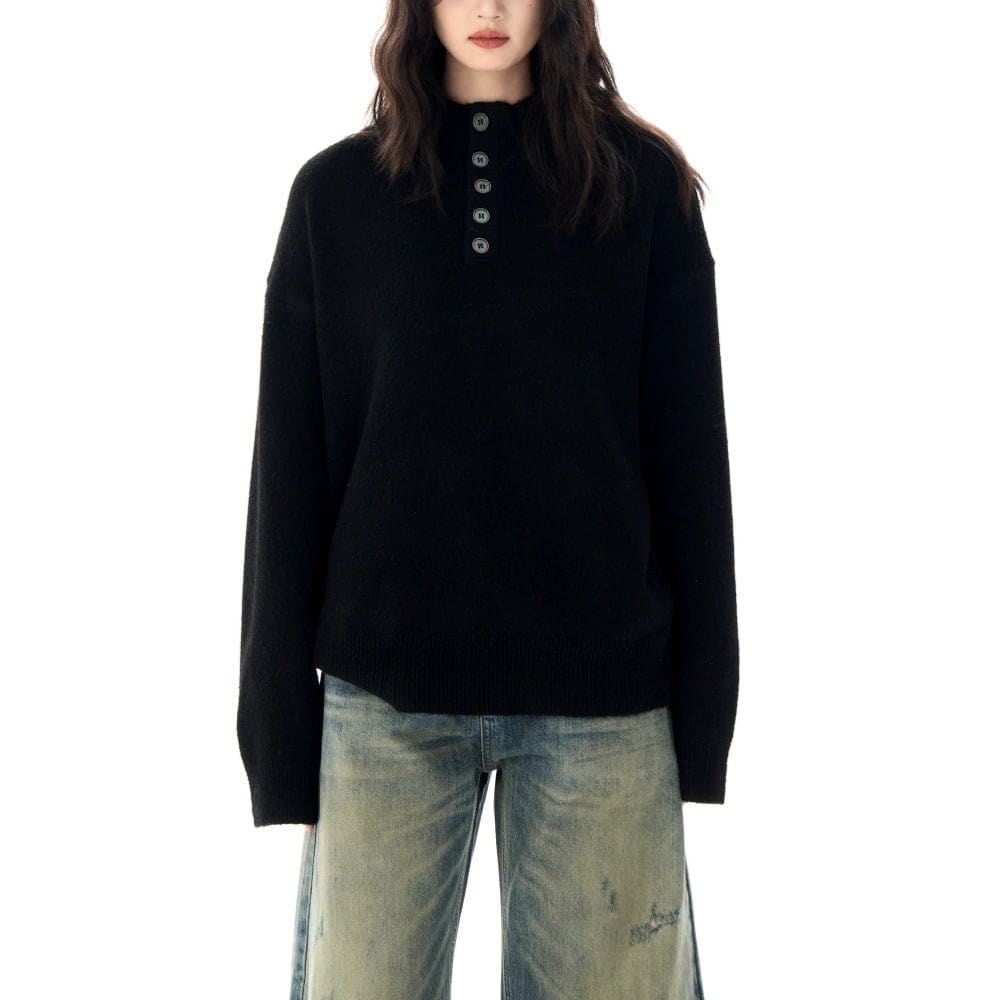 A model wears a relaxed fit mock neck Henley sweater with a buttoned neckline and ribbed hem._8
