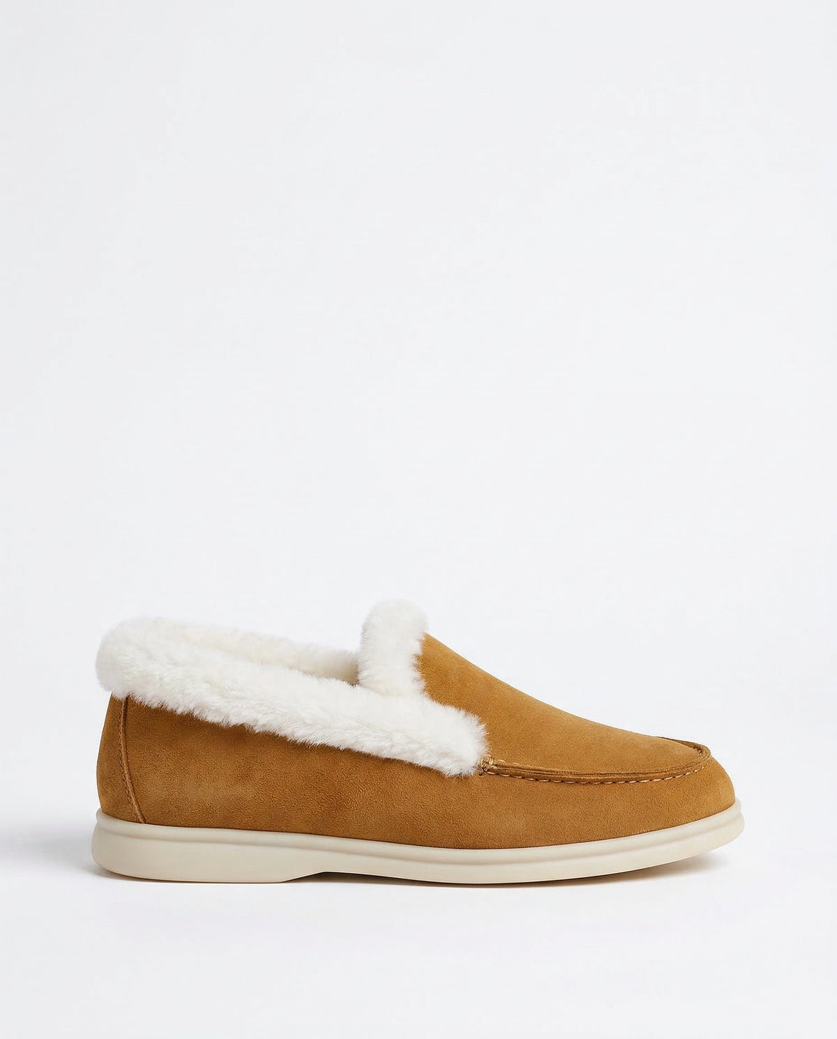 Side view of a shearling lined loafer boot in amber with white fur trim and a cream sole._0