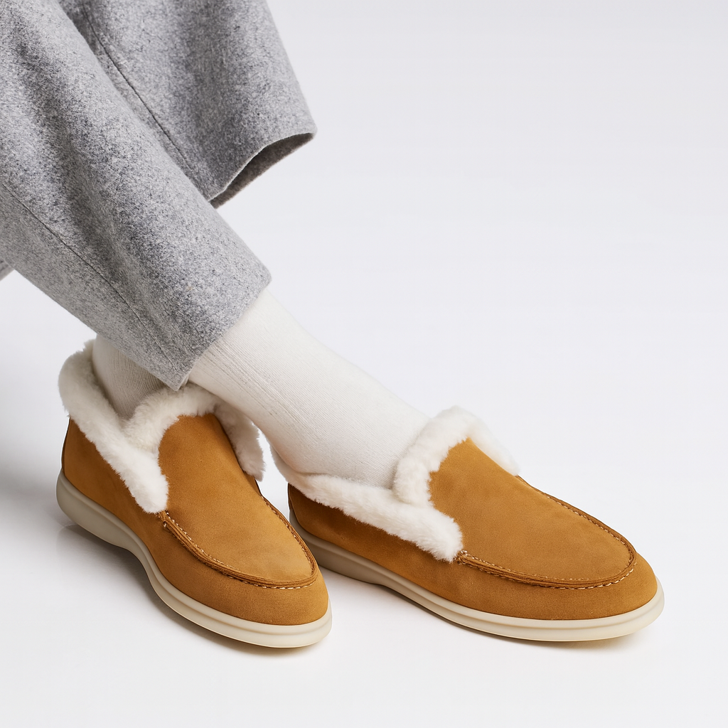 Side view of a shearling lined loafer boot in amber with white fur trim and a cream sole._1