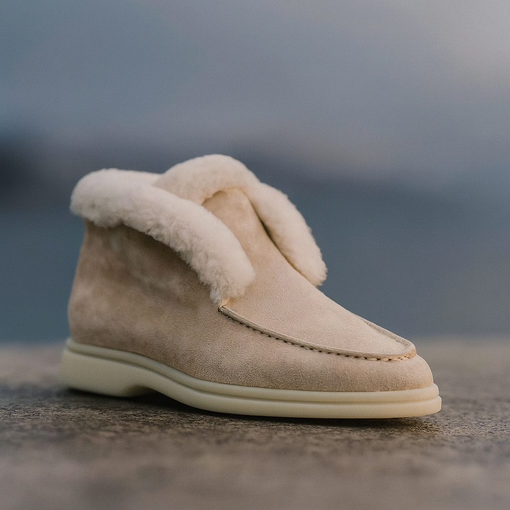 Side view of a shearling lined loafer boot in amber with white fur trim and a cream sole._26