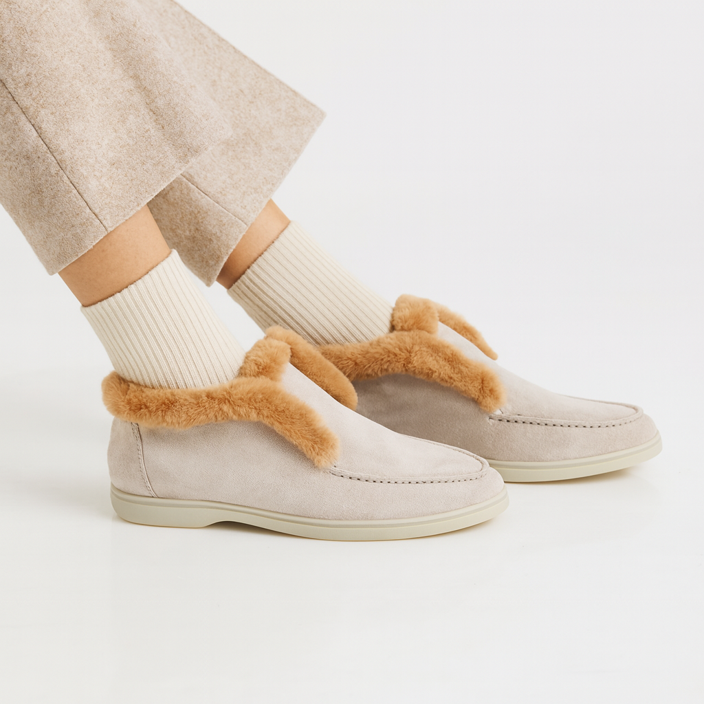 Side view of a shearling lined loafer boot in amber with white fur trim and a cream sole._3