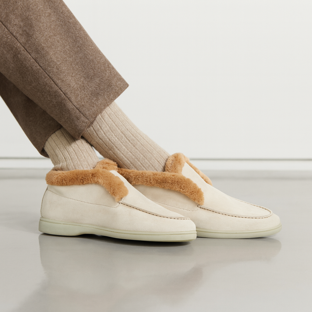 Side view of a shearling lined loafer boot in amber with white fur trim and a cream sole._4