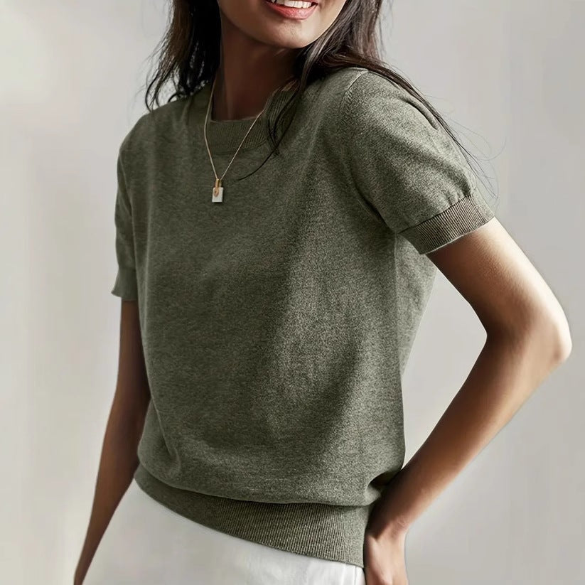 Olive short sleeve crew neck sweater with ribbed sleeve cuffs and waistband, shown close up on a model.