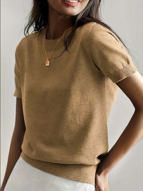 Tan short sleeve crew neck sweater featuring a simple smooth front and ribbed trim.