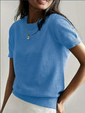 Blue short sleeve crew neck sweater with a clean neckline and textured ribbed lower edge.