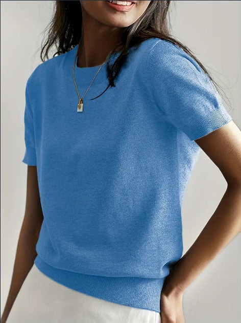 Blue short sleeve crew neck sweater with a clean neckline and textured ribbed lower edge.
