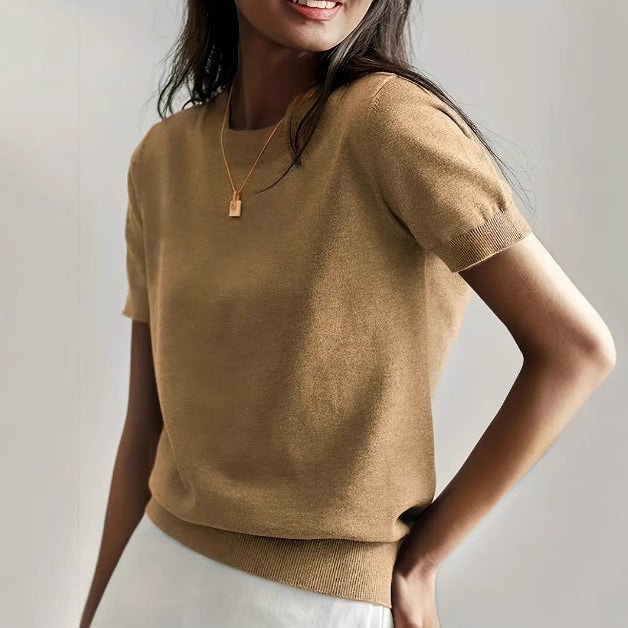 Warm brown short sleeve crew neck sweater with ribbed sleeve cuffs and a fitted ribbed waistband.