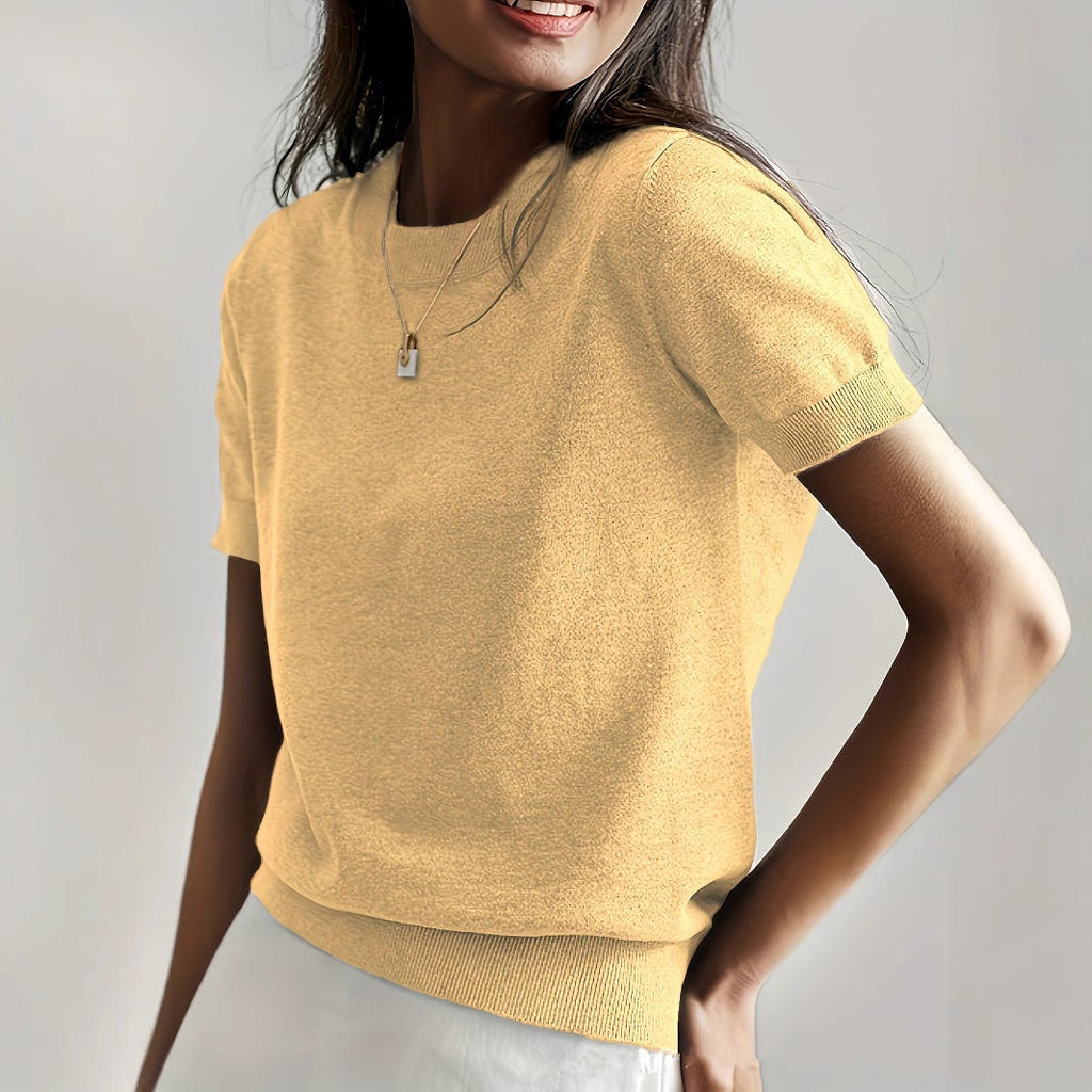Golden yellow short sleeve crew neck sweater shown in a close front view with neatly finished ribbed edges.