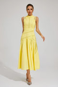 Woman wearing a yellow sleeveless midi dress with lace paneling, crochet trim, and a flared hem._0